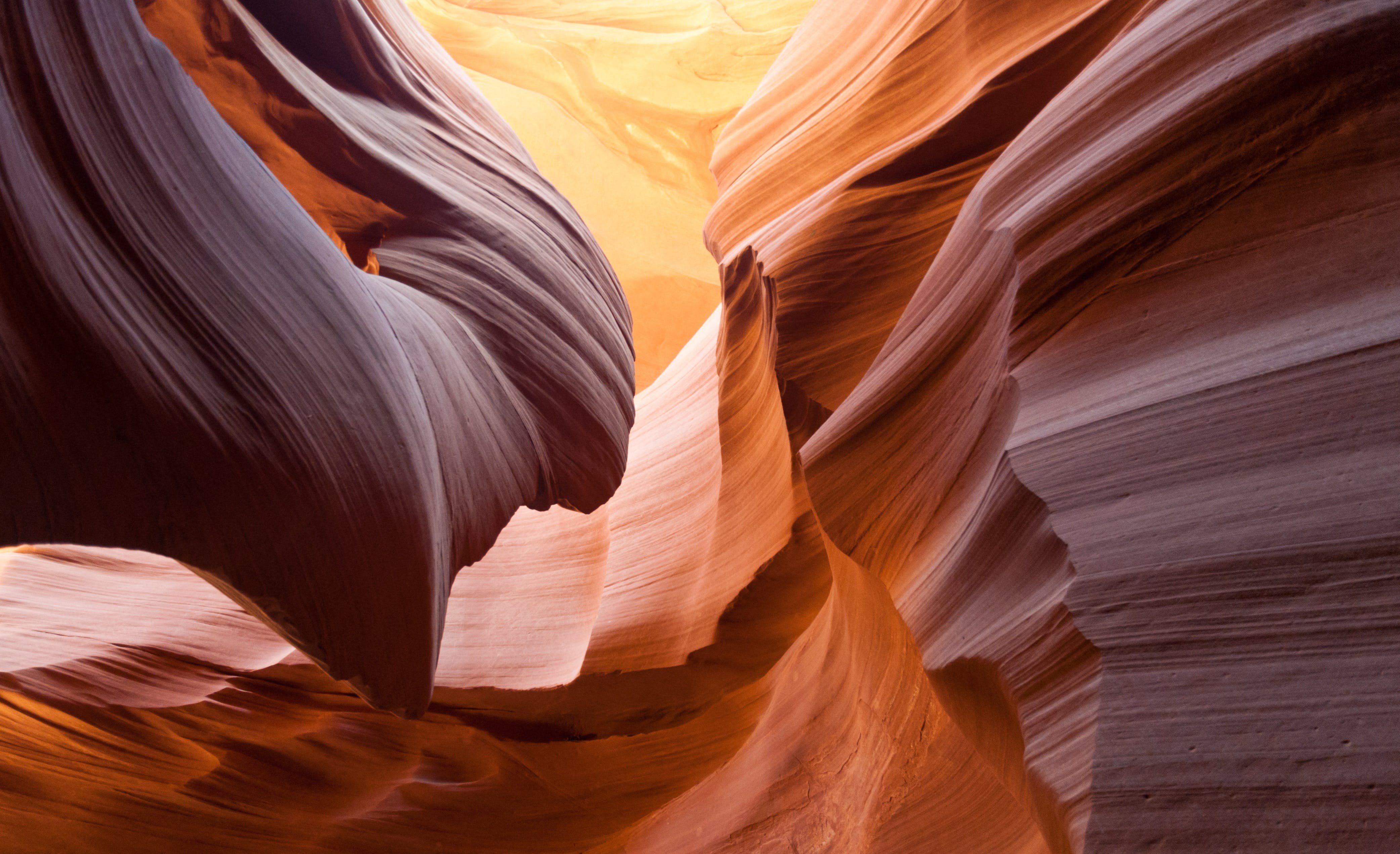 the upper and lower canyon walls of antelope canyon at sunset